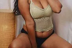 Lola in her Red Bra showing off her deep clevage and armpit